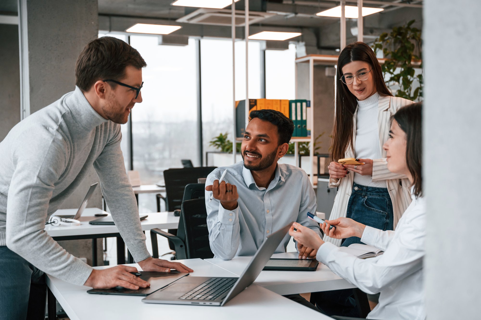 four-people-are-working-office-together